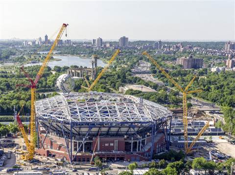 One LR 11000 and two LR 1600/2 cranes erect the steel structure for the roof on the Arthur Ashe Stad
